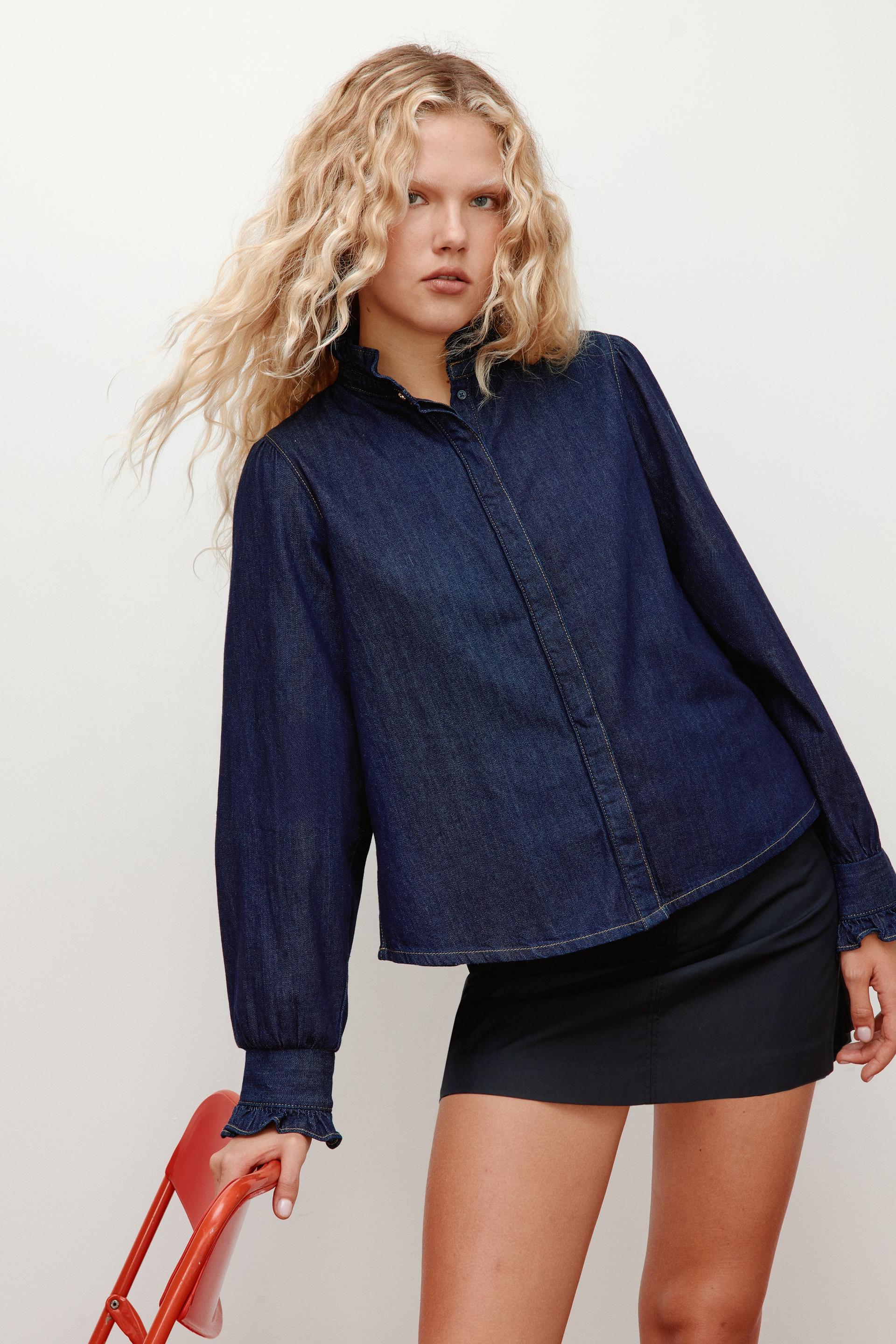 ruffle-trimmed denim blouse