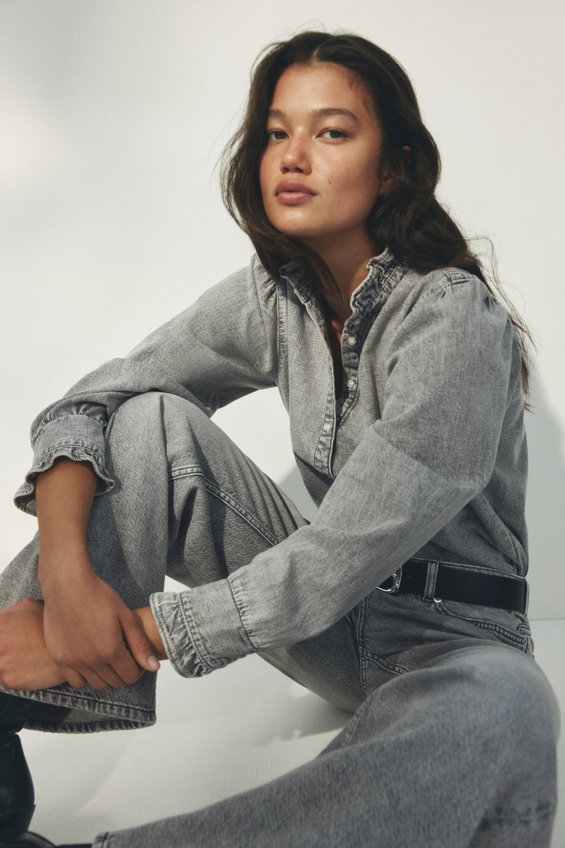 ruffle-trimmed denim blouse