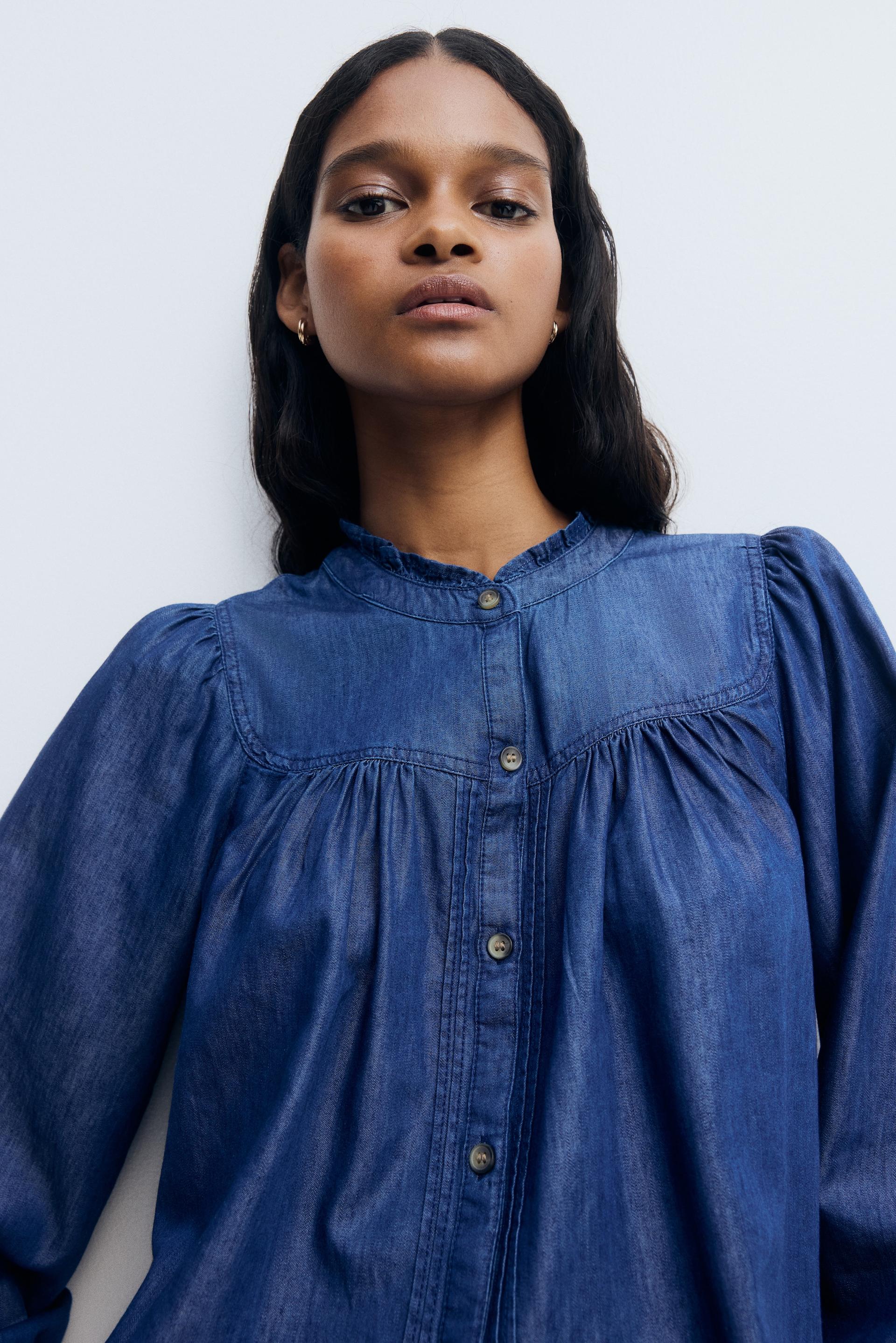 ruffle-trimmed denim blouse