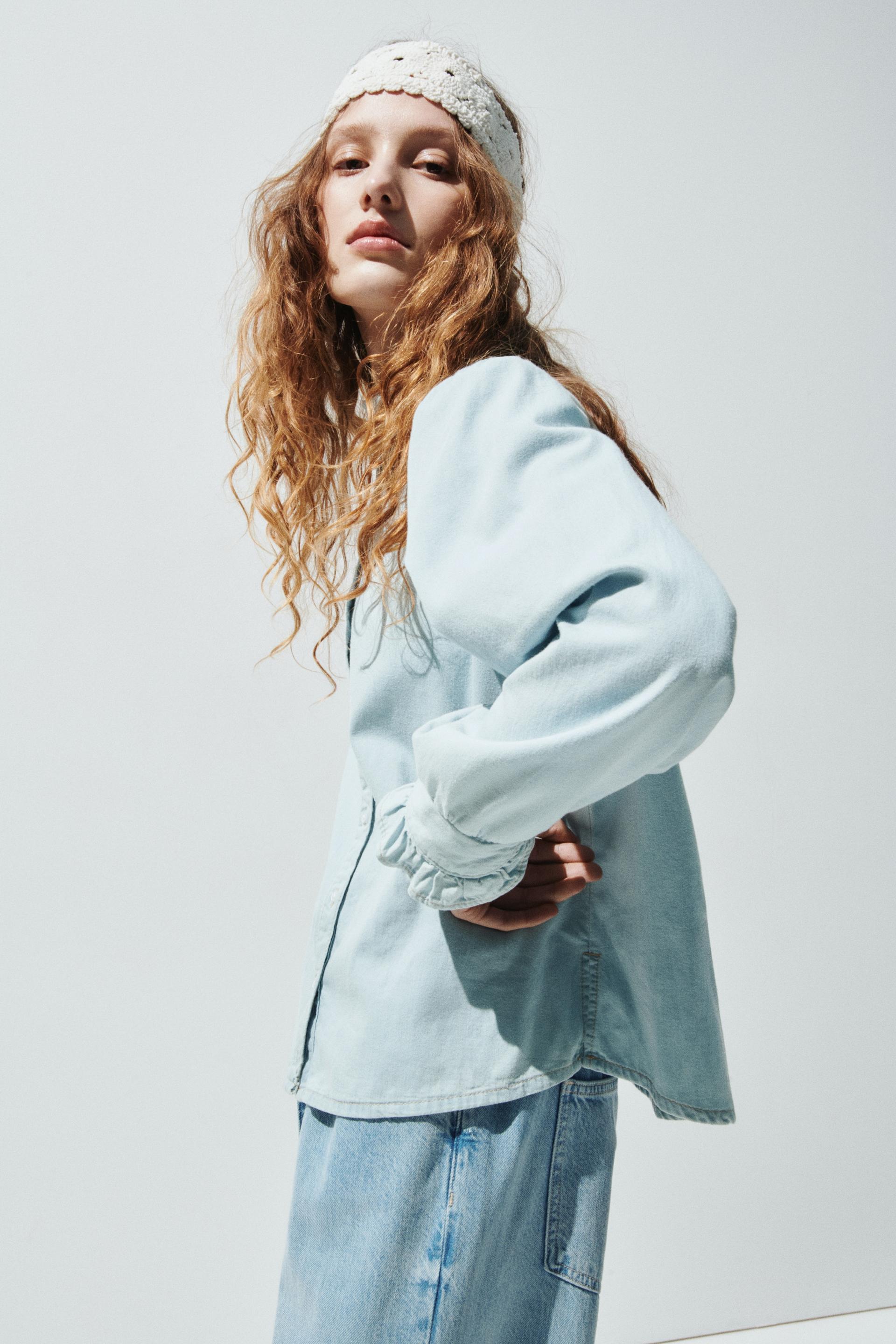ruffle-trimmed denim blouse