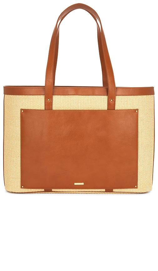 sancia x revolve the udine raffia tote in cognac.