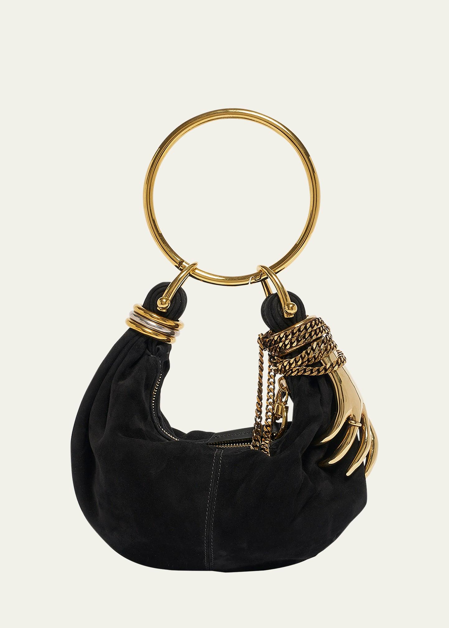 sculptural hand bracelet bag in suede
