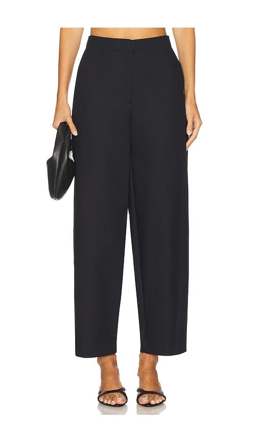 simkhai waldon curved leg pant in black.