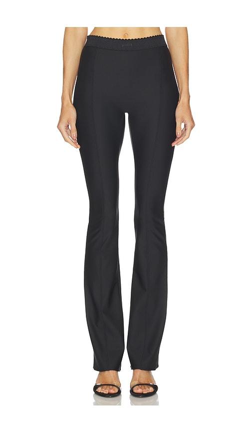 skims body skinny flare pant in black.