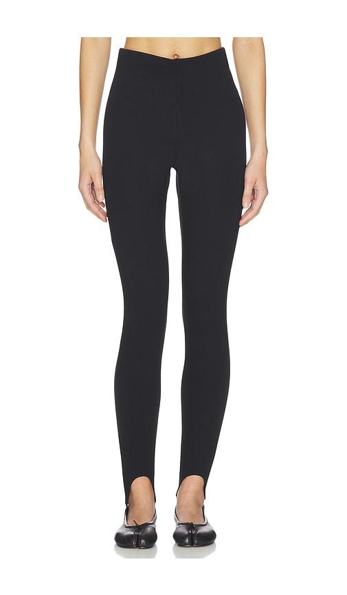 skims essential high waist stirrup legging in black.