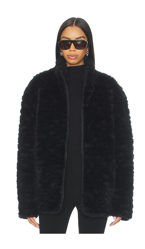 skims faux fur zip up mock neck jacket in black.