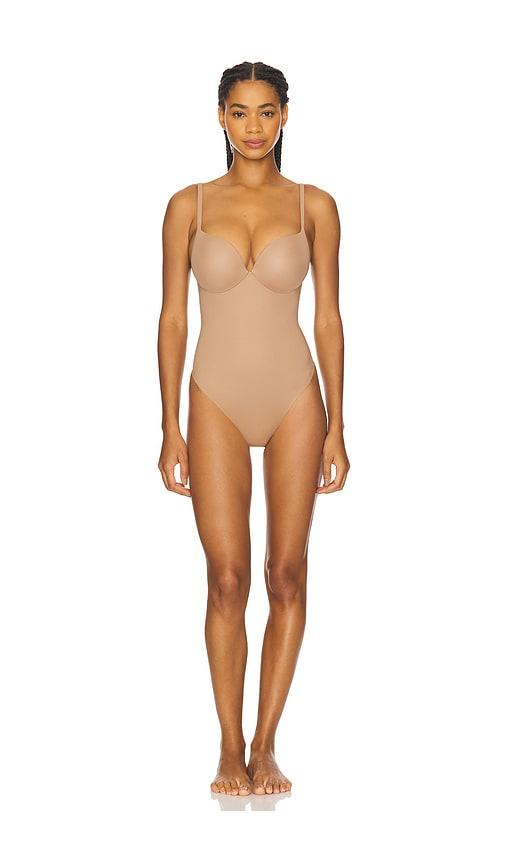 skims push-up thong bodysuit in beige.