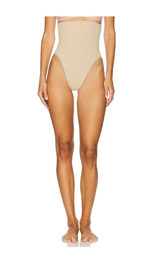skims seamless sculpt high waist thong in tan.