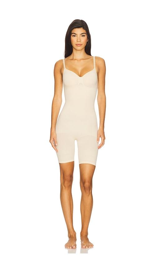 skims seamless sculpt mid thigh bodysuit in nude.