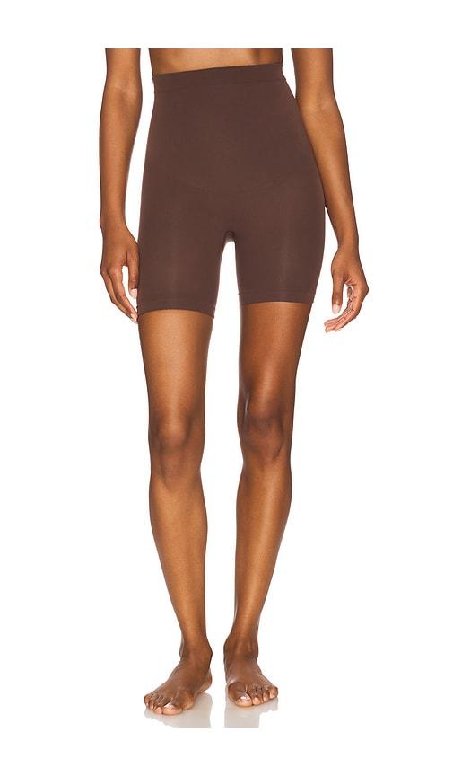skims seamless sculpt mid thigh short in chocolate.