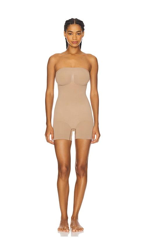 skims seamless sculpt strapless shortie bodysuit in beige.