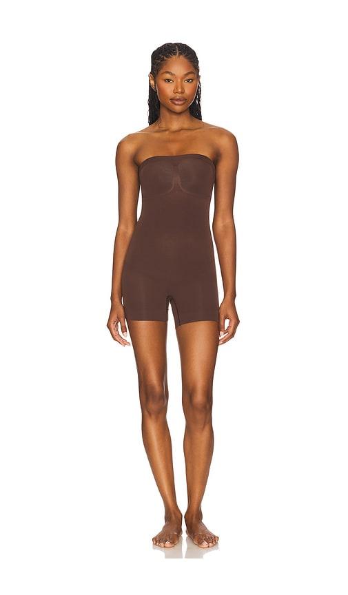 skims seamless sculpt strapless shortie bodysuit in chocolate.