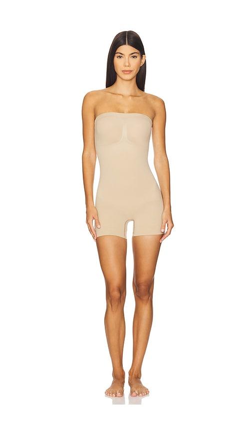 skims seamless sculpt strapless shortie bodysuit in tan.