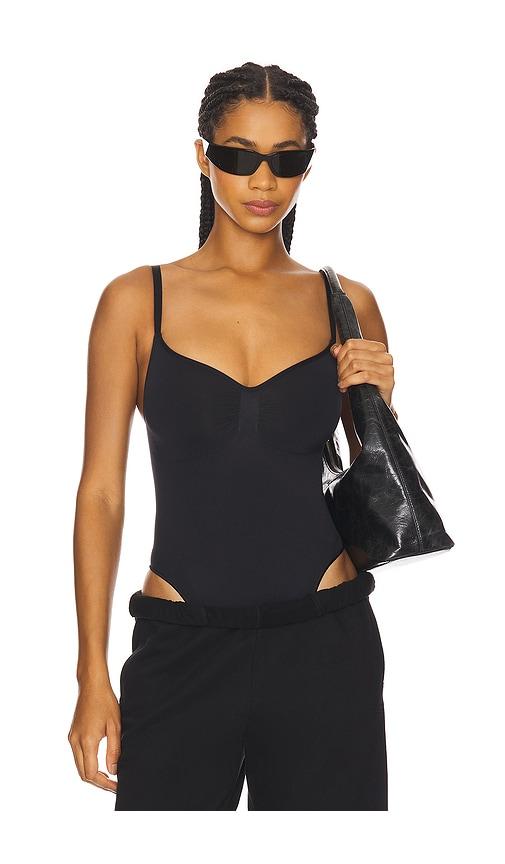 skims seamless sculpt thong bodysuit in black.