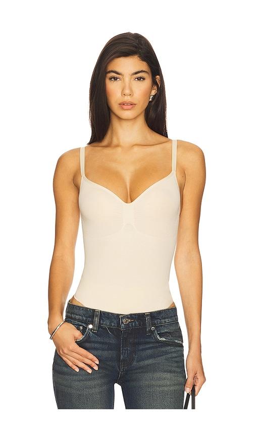 skims seamless sculpt thong bodysuit in nude.