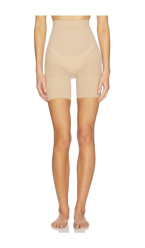 skims sheer seamless mid thigh short in tan.
