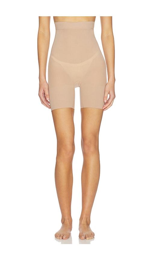 skims sheer seamless mid thigh short in taupe.