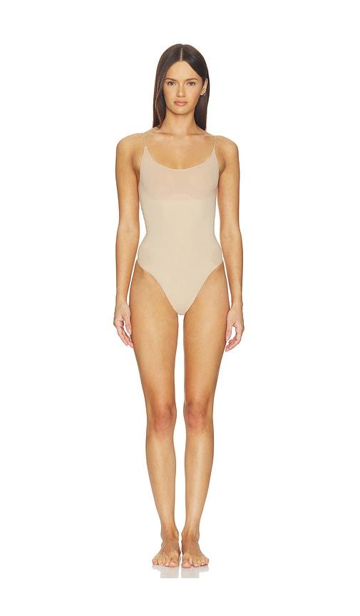 skims sheer seamless thong bodysuit in nude.