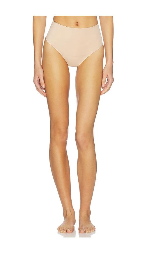 skims smoothing intimates high-waisted thong in tan.