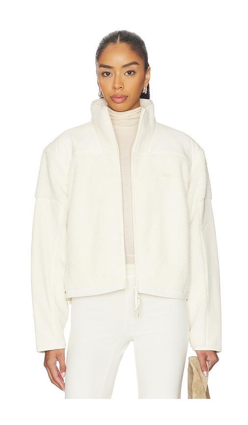 skims teddy boxy zip up jacket in beige.