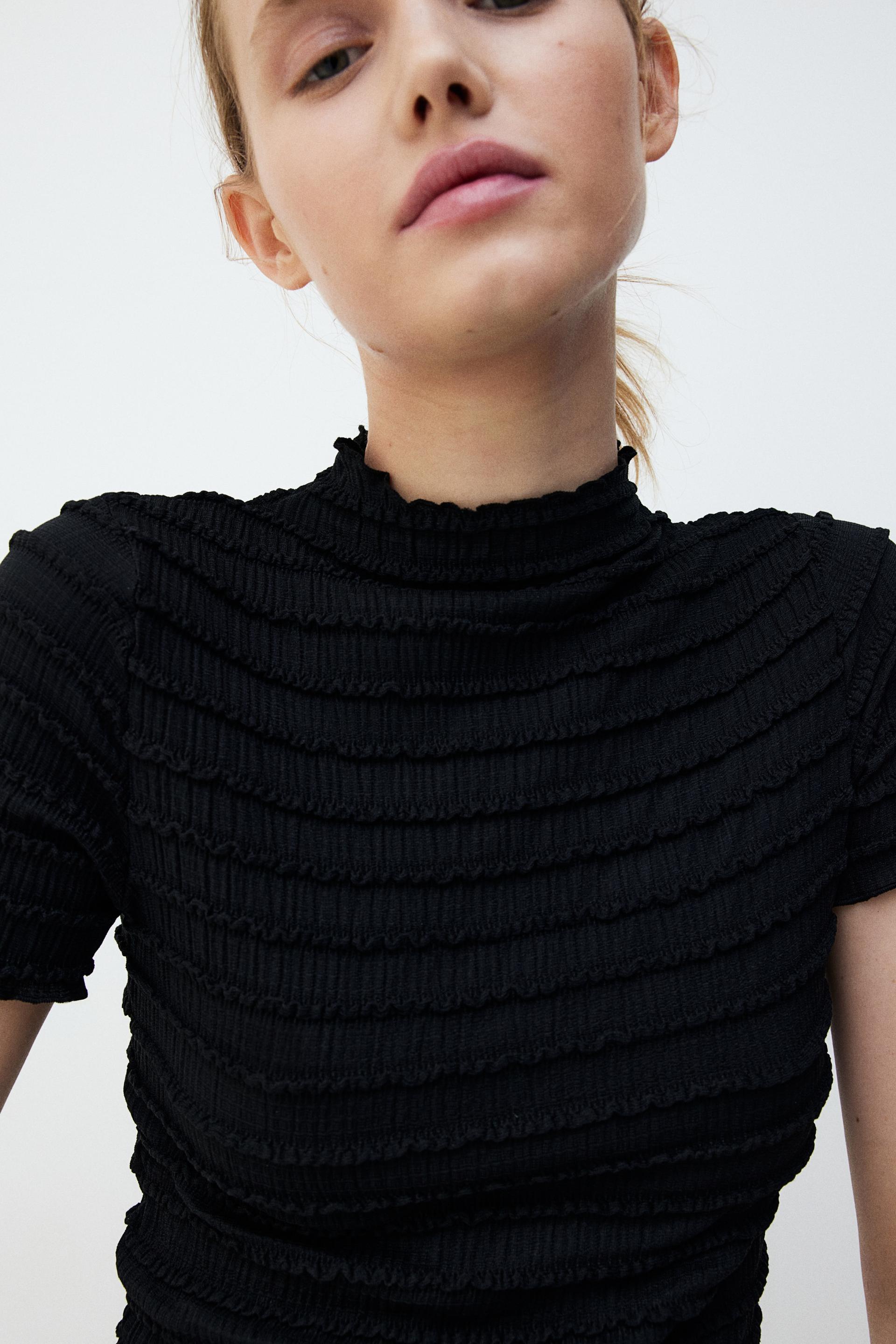 smocked top with overlocked trim