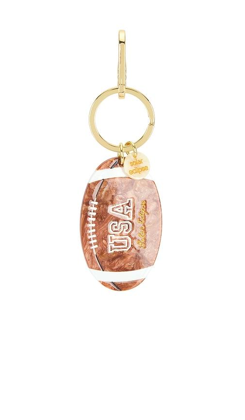 solar eclipse hand-painted vintage football bag charm in metallic bronze.