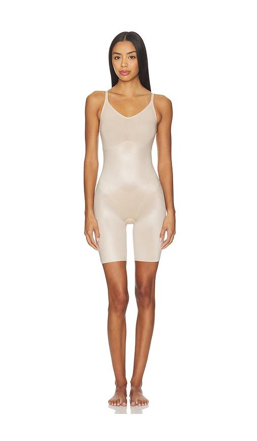 spanx shape invisible shaping closed bust mid-thigh bodysuit in beige.