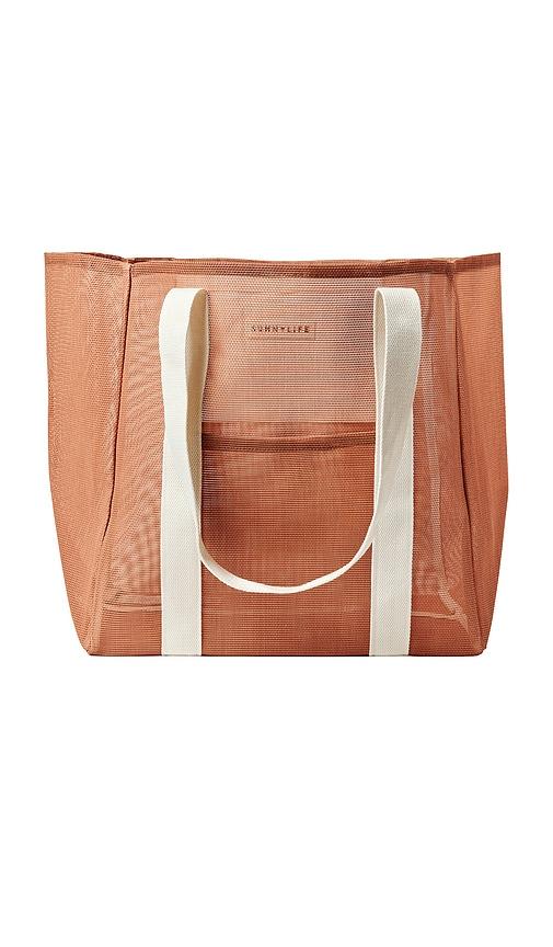 sunnylife mesh beach bag in burnt orange.