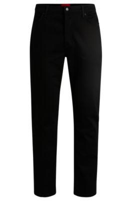 tapered-fit jeans in black-black stretch denim- black men's jeans
