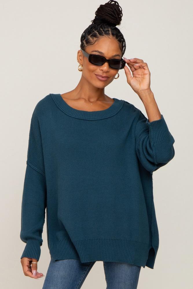 teal exposed seam side slit sweater