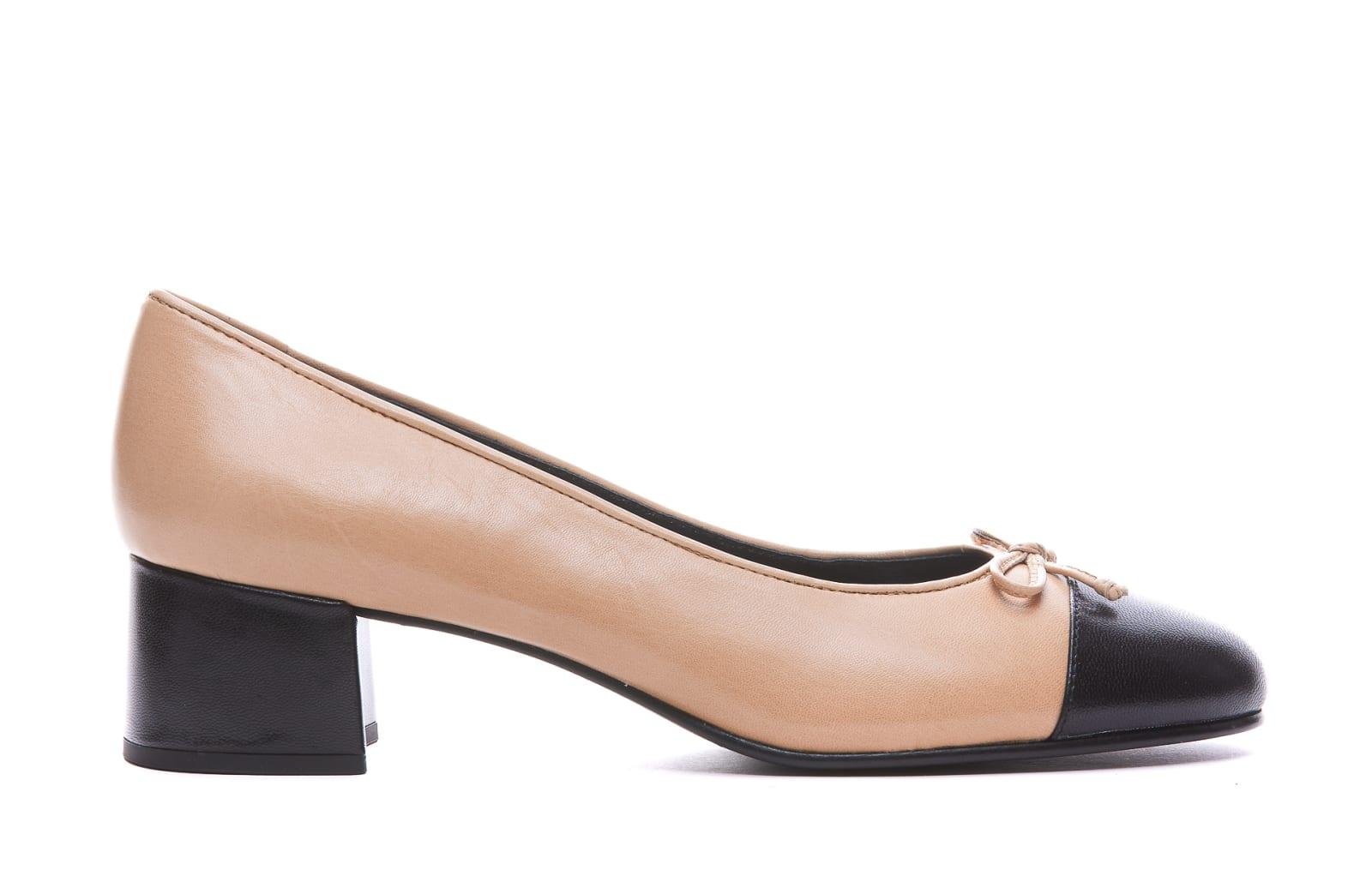 tory burch ballet flats with bow detail and bi-color toe in smooth leather