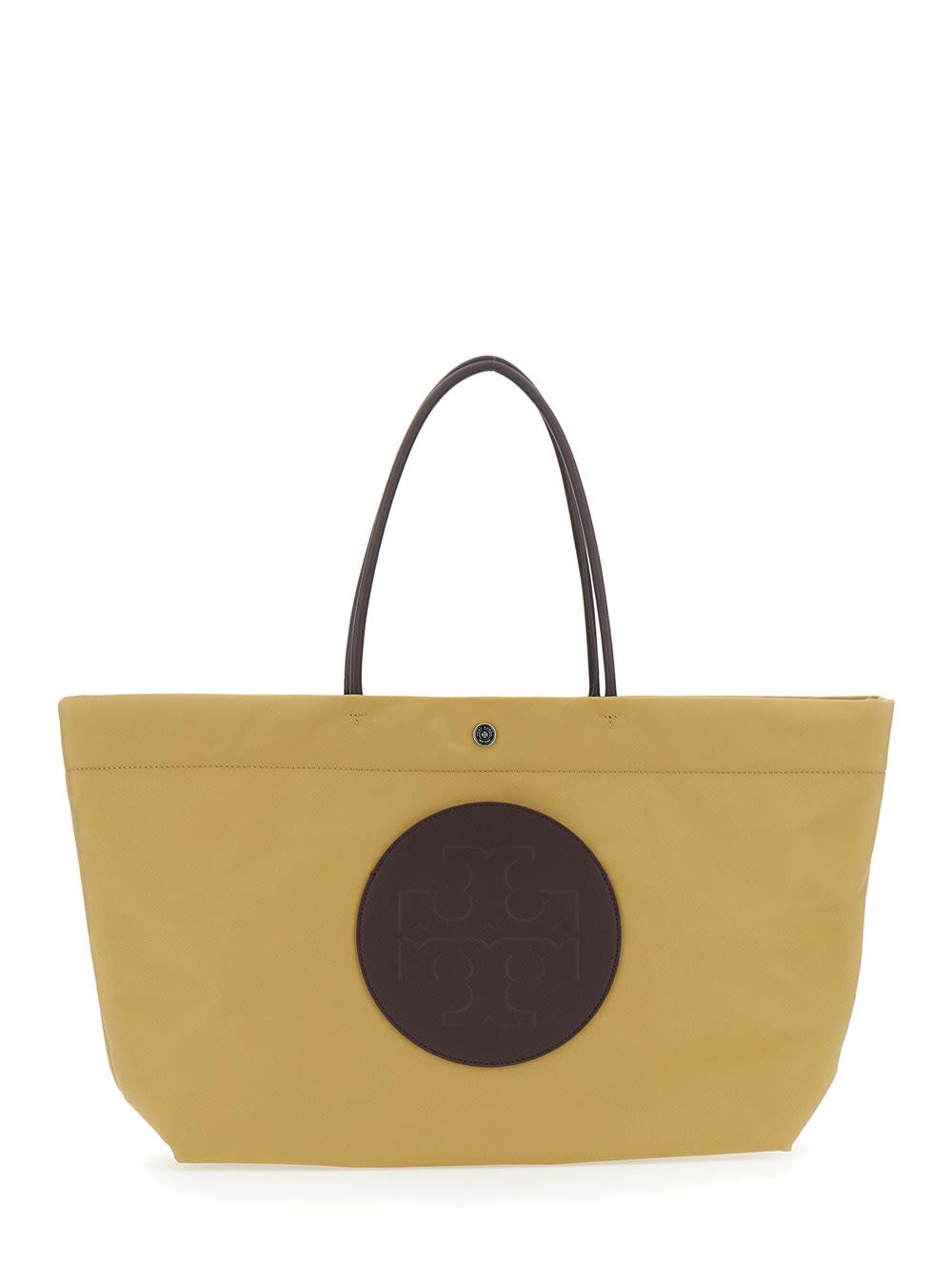 tory burch ella twist tote bag with two top handles and logo on front in yellow ecoleather for women