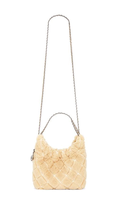 tory burch fleming shearling mini hobo bag in ivory.