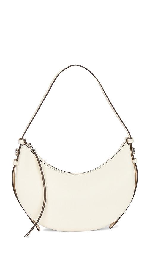 tory burch romy half moon bag in cream.