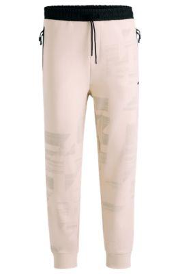 tracksuit bottoms with seasonal artwork- white men's jogging pants
