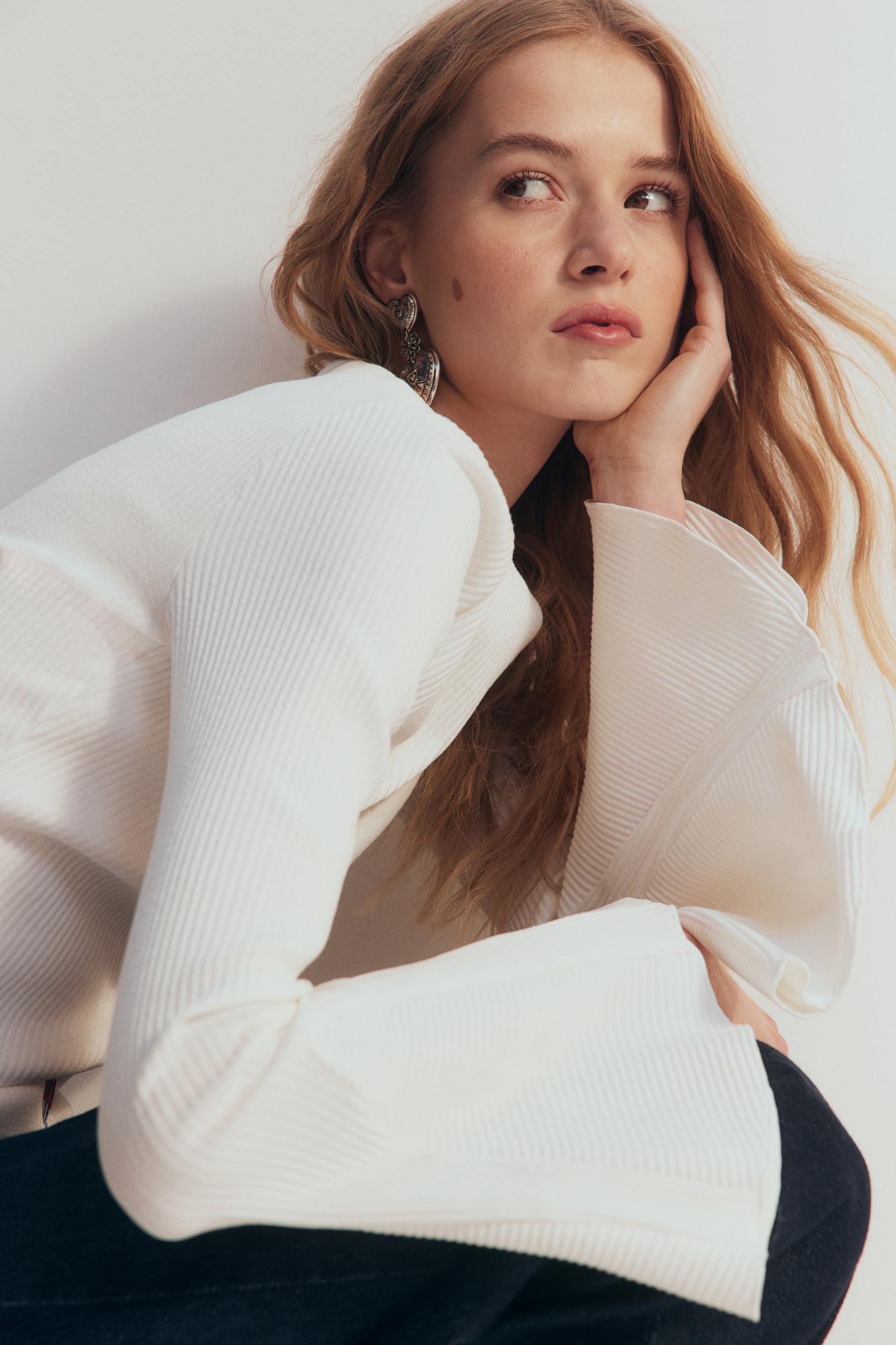 trumpet-sleeved ribbed top