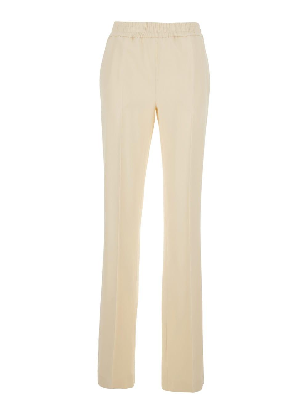twinset beige pants with elastic waist and logo plate on the back