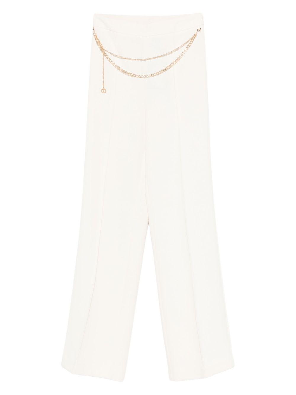 twinset white trousers with chain waistband.