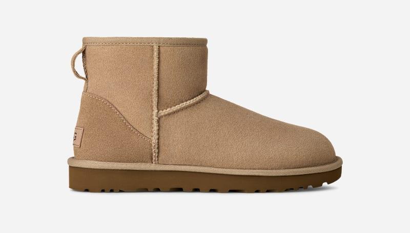 ugg® women's classic mini ii sheepskin classic boots in sand,