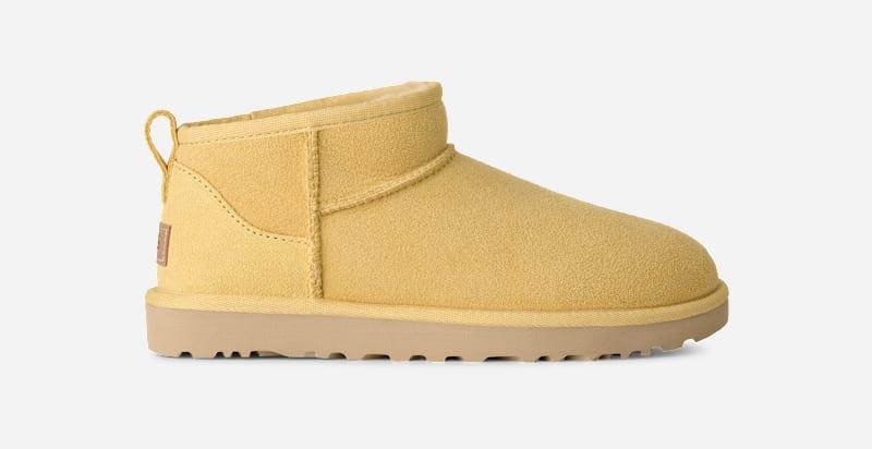 ugg® women's classic ultra mini sheepskin classic boots in muted mustard, size 10