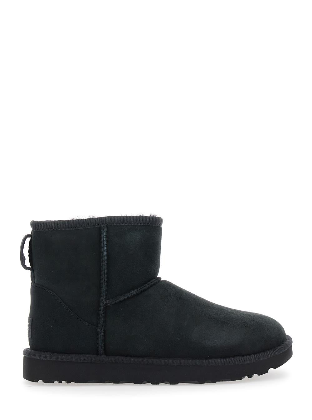 ugg classic mini black ankle boots with logo patch on the rear in suede woman