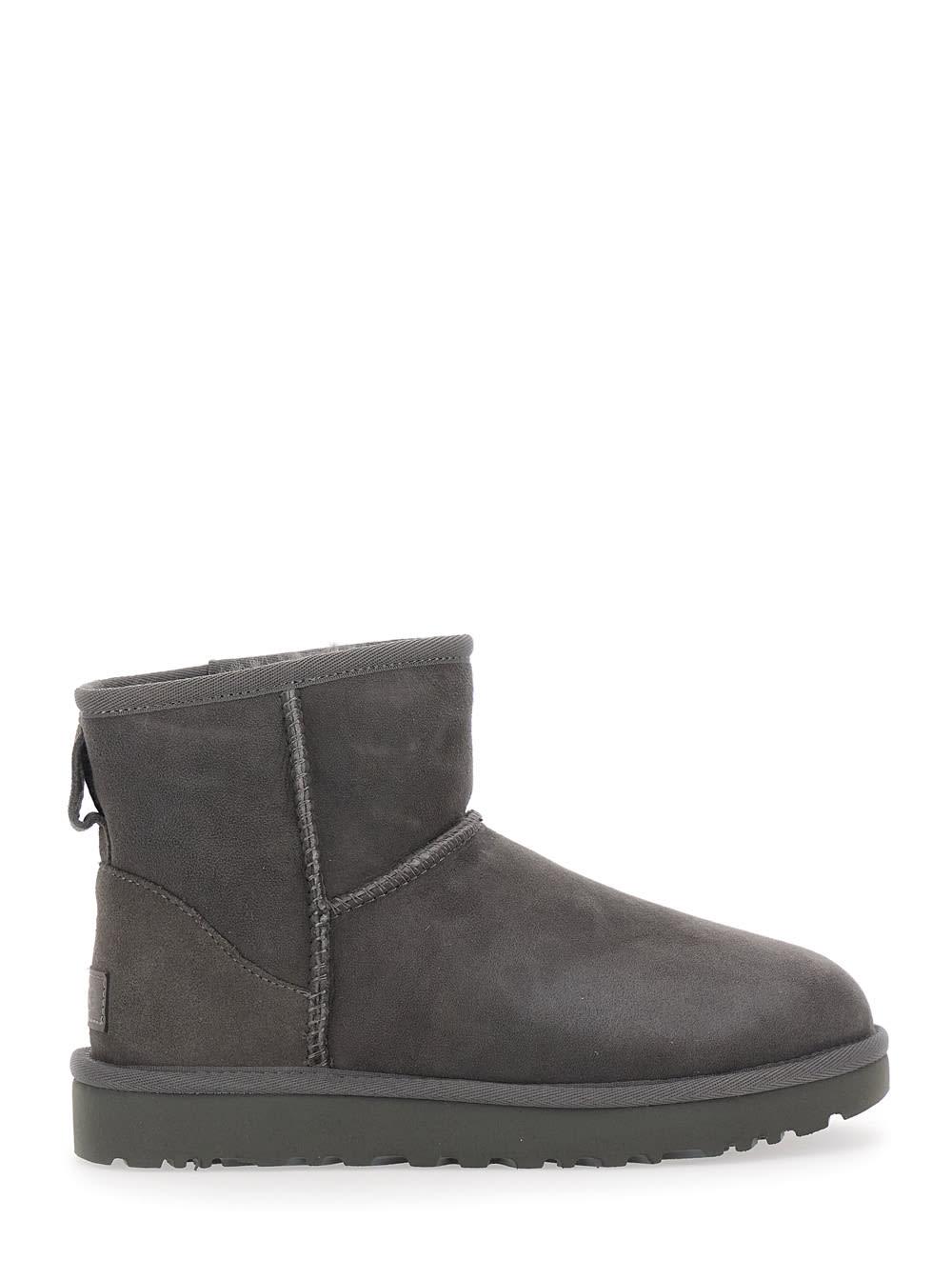 ugg classic mini grey ankle boots with logo patch on the rear in suede woman