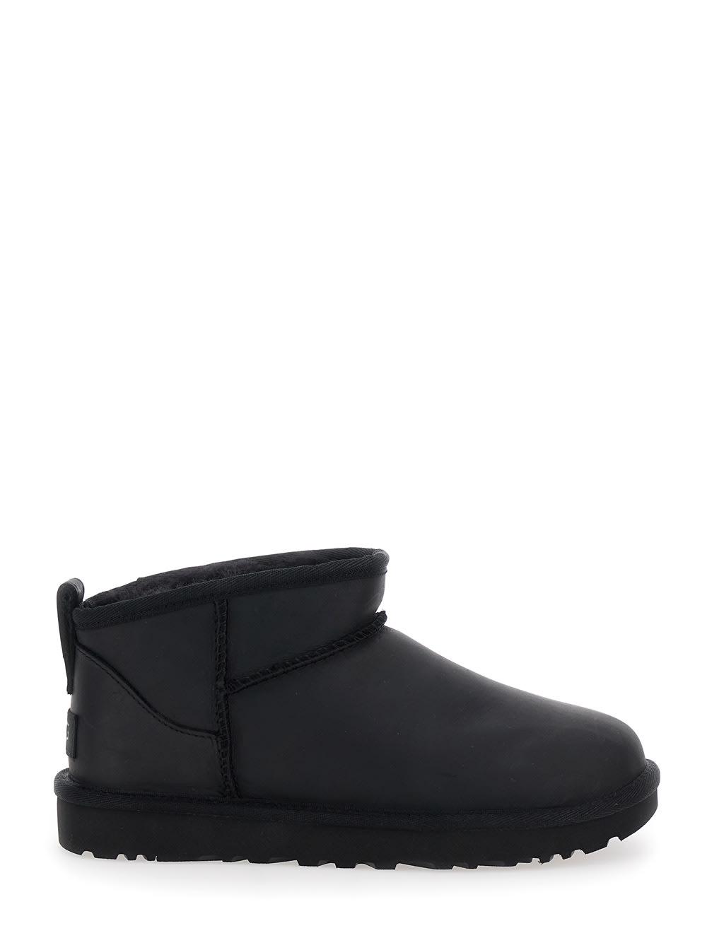ugg classic ultra mini black ankle boots with shearling lining in leather woman