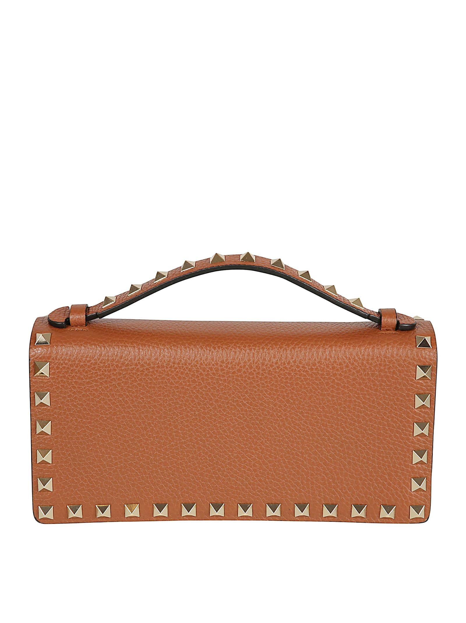 valentino garavani rockstud-embellished clutch bag