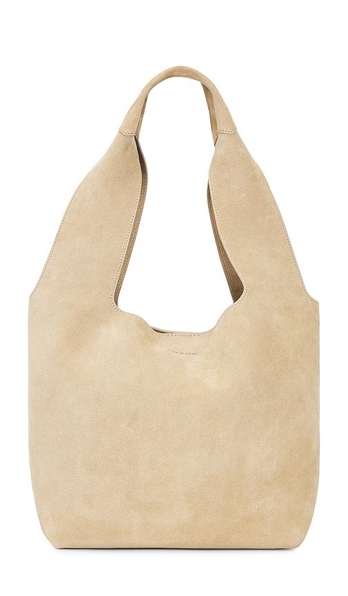 veronica beard suede sling bag in tan.