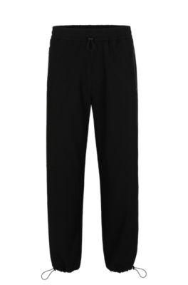 water-repellent trousers with adjustable hems- black men's casual pants