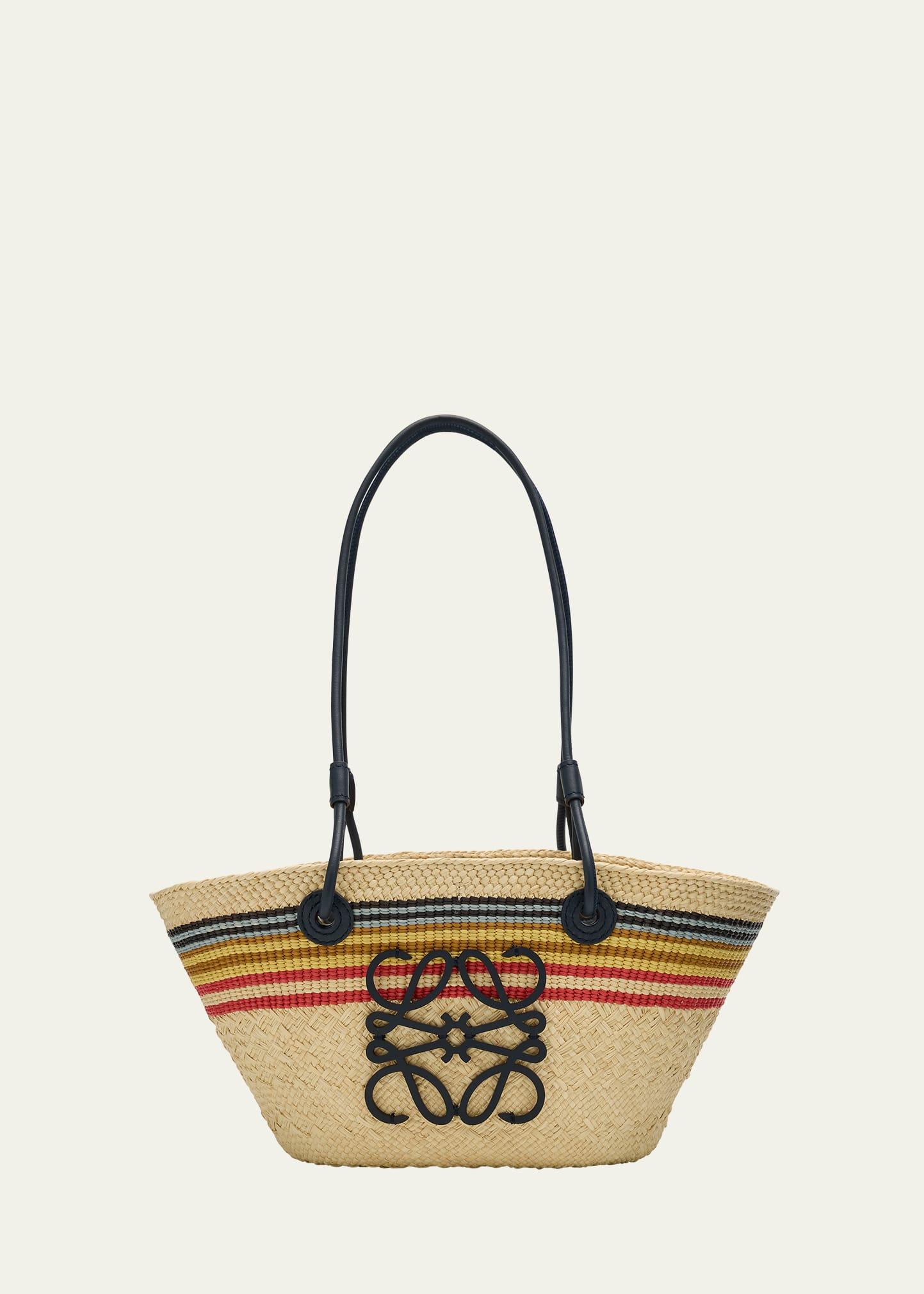 x paula’s ibiza small anagram striped basket tote bag in raffia